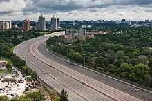 An empty freeway in the middle of a city.