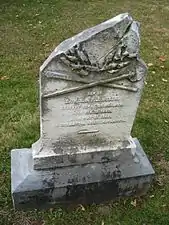 Frederick Huber's headstone shows battle damage.