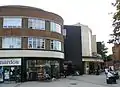 The cinema adjoins the grade II listed parade of shops at 107-123 Muswell Hill Road.