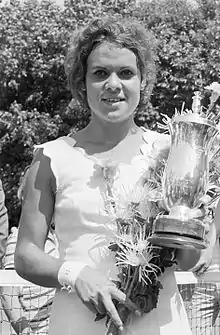 Evonne Goolagong Cawley holding a trophy