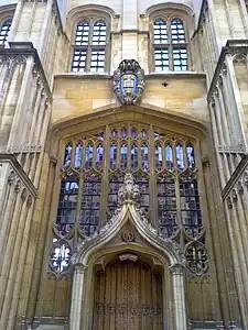 The external door, added by Christopher Wren in 1669 for access to the Sheldonian Theatre,  mounted with the University coat of arms.