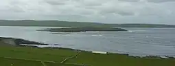 Eynhallow viewed from Rousay, from the north-east, with the Orkney Mainland beyond