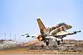 An F-16I Sufa with full power afterburner takeoff at Hatzerim Airbase