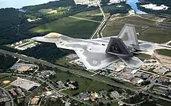 The first operational F-22A Raptor flies over Tyndall AFB on its delivery flight during 2003.