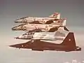 F-4N Phantoms of VFMA-323 in flight with CF-5A and CF-5B 1973