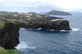 The coast of Feteira, showing the rocky cliffs and vista of Monte da Guia (to the east), Faial  Island