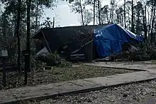 A damaged home with debris on it in southern Alabama