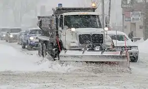 Snowplow with spreader body