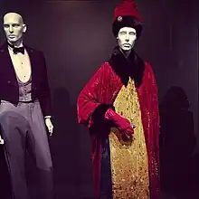Shot of a FIDM Museum costume exhibit, highlighted by Gustave's signature uniform and Madame D's ornate coat-and-gown ensemble