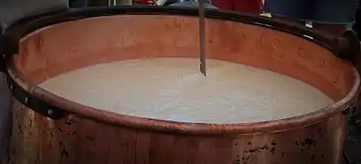 "Scaling", stirring with a set of wires to cut the curd