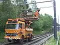 Road-rail vehicle with elevated platform for installing catenary