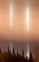 Pillars from uncovered work lights above University of Alaska Fairbanks