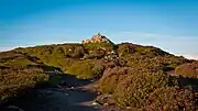 Fairy Castle: the mound on which the cairn and trig pillar sit is a passage grave