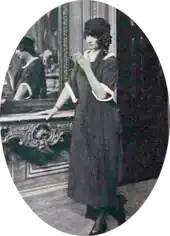 Young white woman in mourning clothes, smoking a cigarette
