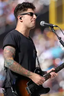 Trohman performing with Fall Out Boy in 2016