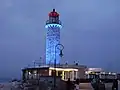 Lighthouse of Patras illuminated at night.