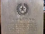 Monument in Farwell, Texas, noting the Farwell brothers as receiving the land which became the XIT in exchange for constructing the Texas State Capitol building