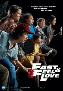 Official movie poster, showing six actors with determined looks facing right. Each carries a common household object as a weapon. The tagline is, "An action movie about daily life. Feel the speed. Feel the love."