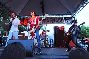 The Fastbacks at a 2011 reunion gig. Left to right: Kurt Bloch, Kim Warnick, Mike Musburger (rear), Lulu Gargiulo