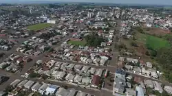 Clockwise from top: Panoramic view of the city center; Mother Church; Ipês in Av. Rio Grande do Sul; Plaza Ventura Migliorini and partial view of downtown.