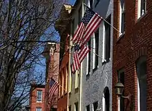 Brick rowhouses with flags