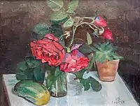 A still life with red roses in a glass vase, 1929
