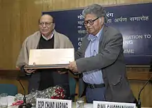 Man receiving award in a classroom