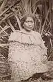 Maori woman wearing the traditional costume made of flax fibre, c. 1880