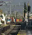 A Ferrosur Roca freight train at Banfield train station.