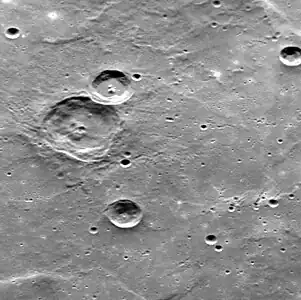 Oblique view of Fet crater (upper left) in Tir Planitia, showing the nature of the smooth plain.