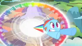 A young blue pegasus with a rainbow-colored mane blasts upward from the ground with a large circular rainbow explosion in her wake. She has a shocked expression on her face.