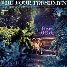 Image of two children (one boy, one girl) sitting on steps in a forest. The words "The Four Freshmen" are shown in all caps on the top of the image. The words "first affair" are shown in lowercase pink letters over the top of the staircase.