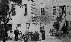 First Albanian School for girls, Korçë, 1899. Teachers Poliksena Luarasi and Thanas Sina, with students.