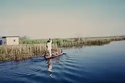 a fisherman riding a boat