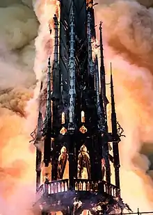 The flèche aflame during the 2019 fire, before its collapse