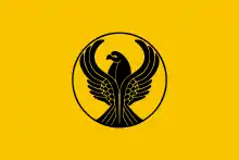 Yellow flag with a stylized black eagle in the center. The eagle's wings are spread.