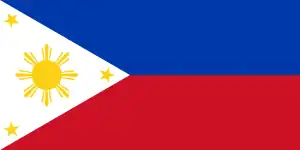 Flag of the Philippines (1898). The yellow sun is in the middle of the triangle shape.