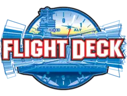 The script text of "Flight Deck" is in white with red outlines in the lettering. A reverberation effect of the words is angled behind the "Flight Deck" in various shades of blue to white. An aircraft carrier's deck is depicted in blue below the lettering, with a control tower located above the "g" and "h". A fighter jet colored blue is seen coming into land between the words, with a fading yellow sunset in the background. A compass circles the aircraft carrier in blue.