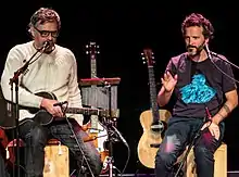Jemaine Clement (left) and Bret McKenzie (right) performing in London in 2018