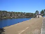 Rental cabins in background, along reservoir cove