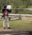 A flintlock musket being fired