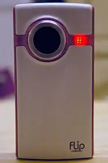 The Flip Video Ultra camera. The red light shows that the video camera is recording.