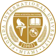A gold and white seal. On the outer roundel are the words Florida International University and Miami, set in a serif. A shield topped with the motto "Spes Scientia Facultas" dominates the middle. Beneath are a torch, book, and globe. A scroll beneath the shield contains the year of foundation, 1968, and a laurel.