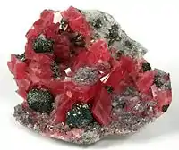 Rhodochrosite with fluorite, tetrahedrite and quartz.