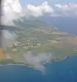 Flying towards the north end of the island, looking down part of the west or Caribbean coast