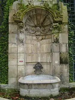 Fontaine de L'Abbaye de Saint-Germain-des-Pres, (1714-1717).   It was moved in the 19th century to make room for the Boulevard Saint-Germain, and now is in Square Langevin, in the 5th arrondissement.