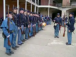 Civil War re-enactors wearing shell jackets, kepis and greatcoats