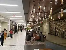 Entrance to former Macy's store location reconstructed to additional mall space.