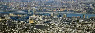 Fort Lee, New Jersey, in the foreground, connected by the George Washington Bridge to Upper Manhattan, New York City, across the Hudson River, in the background (2014)