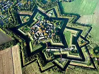 Fort Bourtange, a bastion fort, was built with angles and sloped walls specifically to defend against cannon.